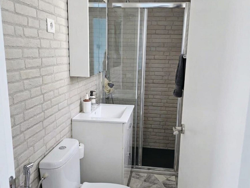 Cветлый двухуровневый апартамент в Pineda de Mar с большими террасами. Фото:  11